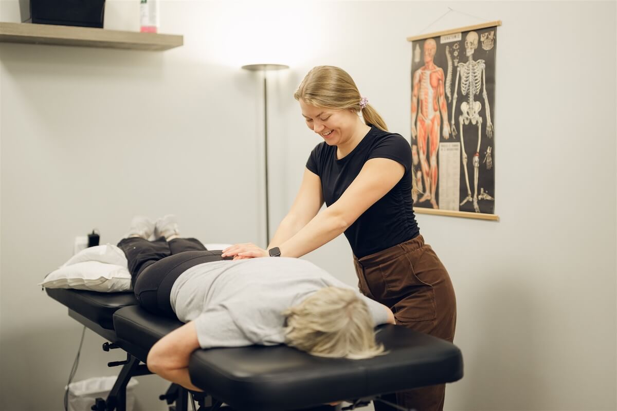 Massage therapist working on a client's back at our Osoyoos clinic